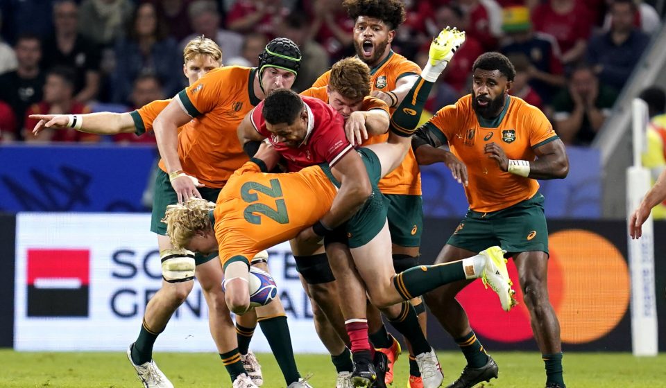 Australia's Carter Gordon is tackled by Wales' Taulupe Faletau during the Rugby World Cup 2023, Pool C match at the OL Stadium in Lyon, France. Picture date: Sunday September 24, 2023. - Photo by Icon sport