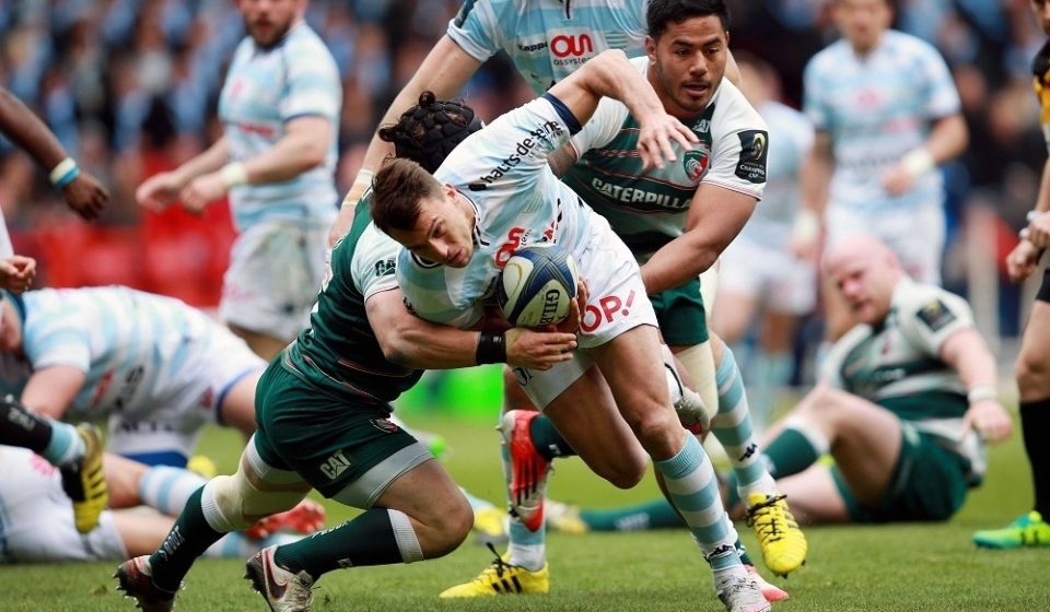 Racing 92's Juan Imhoff is tackled by Leicester Tigers' Harry Thacker and Manu Tuilagi during the European Champions Cup, Semi-Final match at The City Ground, Nottingham.